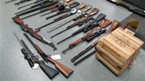 Firearms and ammunition that were seized from two homes in southwestern Saskatchewan are seen in this photo provided by RCMP.