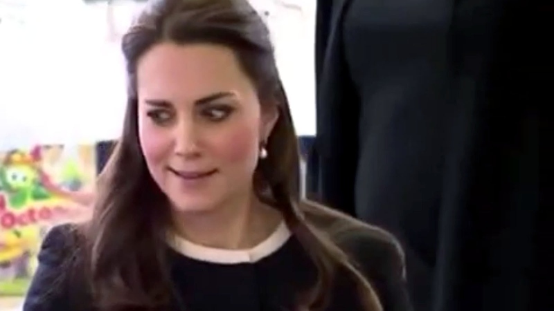 Kate, the Duchess of Cambridge, was caught flashing a side-eye smirk while wrapping presents for children at the Northside Center for Childhood Development in New York, Monday, Dec. 8, 2014.