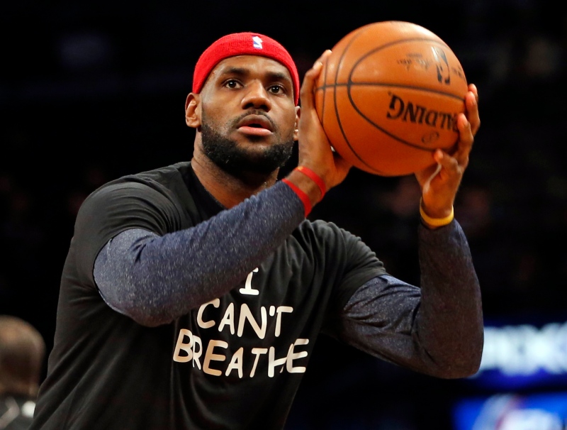 Cleveland Cavaliers forward LeBron James, warms up before an NBA basketball game at the Barclays Center, New York. Cleveland Browns Hall of Fame running back Jim Brown has been encouraged to see athletes make powerful societal statements and voice their opinions in the wake of recent protests around the country. Dec. 8, 2014 (AP / Kathy Willens)