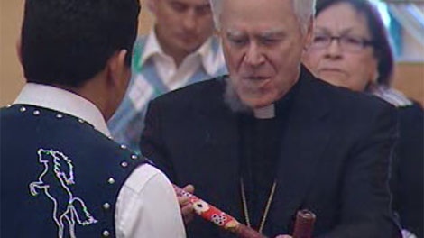 Reverend James Weisgerber, the Archbishop of Winnipeg, smoked a First Nations pipe as part of a reconciliation ceremony based on an ancient tradition in First Nations culture.