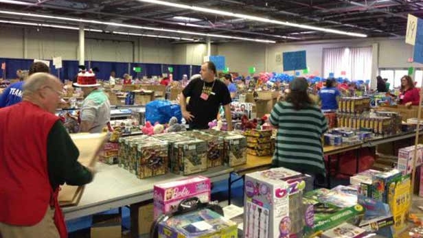 Volunteers work to sort toys for Salvation Army Christmas hampers in London, Ont. on Monday, Dec. 15, 2014. (Nick Paparella / CTV London)