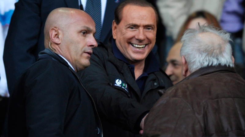AC Milan president Silvio Berlusconi arrives in the stands prior to the Serie A soccer match between Parma and AC Milan, at Tardini stadium in Parma, Italy, Saturday, March 17, 2012. (AP / Marco Vasini) 