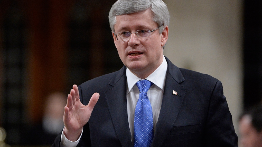 Prime Minister Stephen Harper answers a question 