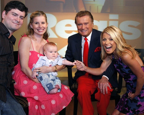 In this image released by Disney-ABC Domestic Television, Regis Philbin, host of 'Live with Regis and Kelly,' poses with his grandson William Xavier Schur, co-host Kelly Ripa, right, Philbin's daughter JJ, second left, and her husband Michael Schur, left, on the set on July 16, 2008, in New York. (AP Photo/ Disney-ABC Domestic Television)