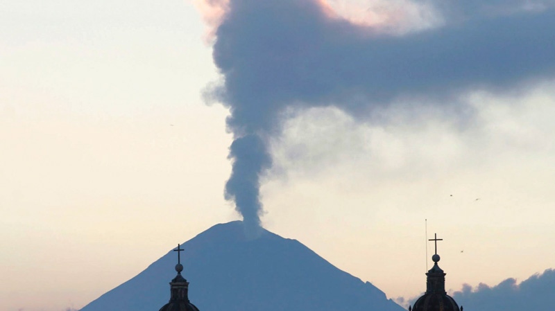 A plume of steam rises from the Popocatepetl volcano seen from the city of Puebla, Mexico, Saturday, April 14, 2012. (AP / Joel Merino)