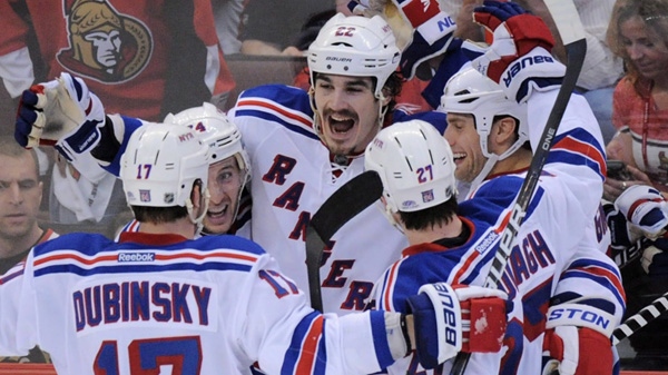New York Rangers' Brian Boyle, centre, celebrates his game winning goal against the Ottawa Senators during the third period of game three of first round NHL Stanley Cup playoff hockey action at the Scotiabank Place in Ottawa on Monday, April 16, 2012. The Rangers defeated the Senators 1-0. THE CANADIAN PRESS/Sean Kilpatrick