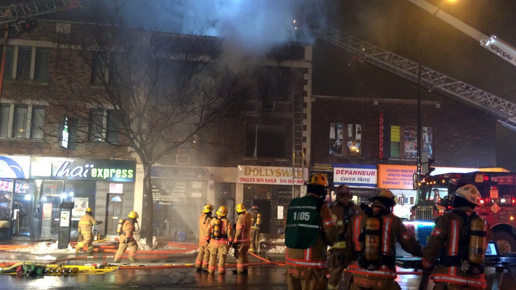 Firefighters battle a building fire on Queen Mary 