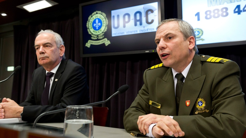 Robert Lafreniere, left, Quebec anti-corruption commissioner, and Denis Morin, head Quebec Provincial Police anti-corruption unit, comment on the 14 arrests made earlier with various counts of fraud Tuesday, April 17, 2012 in Montreal. (Paul Chiasson / THE CANADIAN PRESS)