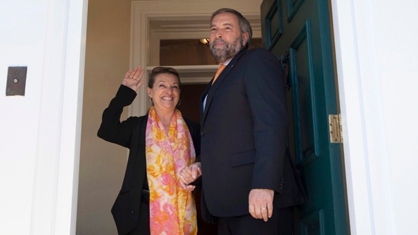 Catherine Pinhas waves as she and her husband NDP Leader Tom Mulcair move in to the residence of the leader of the Official Opposition in Ottawa, Wednesday April 18, 2012. (Adrian Wyld / THE CANADIAN PRESS)