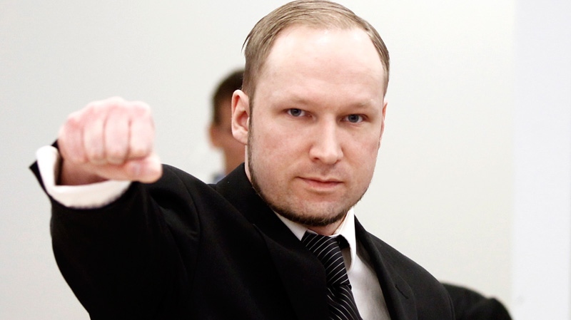 Accused Norwegian Anders Behring Breivik gestures on arrival at the courtroom, in Oslo, Norway, Wednesday April 18, 2012.  (Lise Aserud/Scanpix Norway)