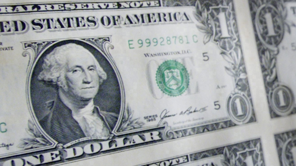 A sheet of U.S. one dollar bills.