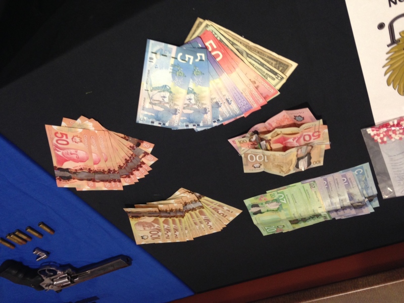 Guns, drugs and cash were seized by OPP following a lengthy investigation in several southwestern Ontario communities. OPP released details of investigation on Friday, December 19, 2014 in London, Ont.