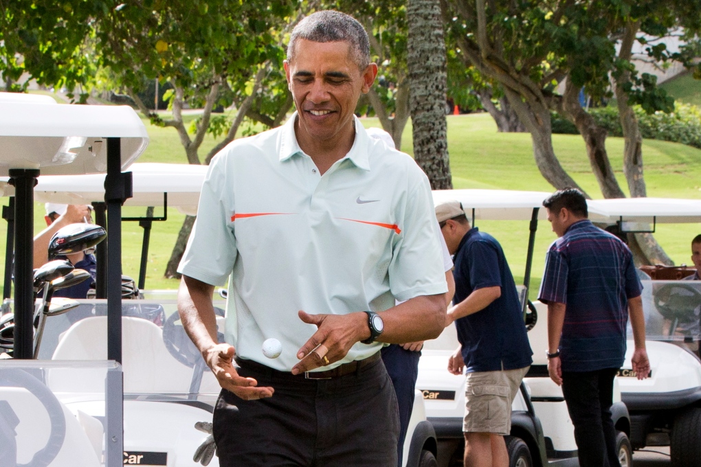 Barack Obama plays golf in Hawaii 