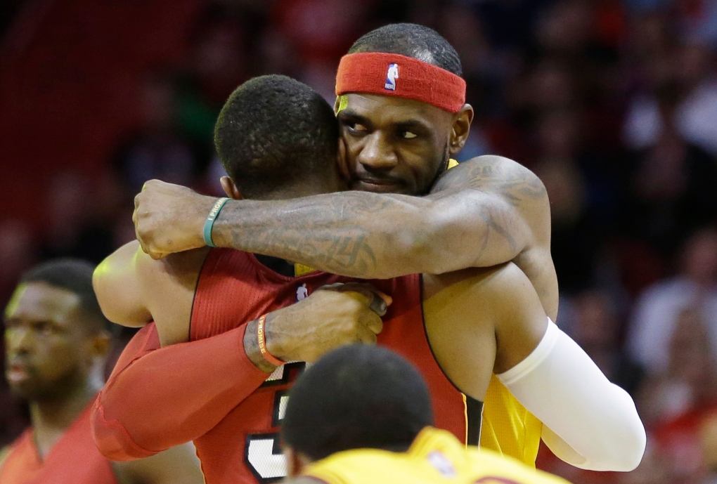 LeBron James hugs Dwayne Wade