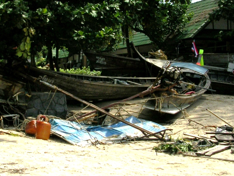 A photo taken by the Lightman family in the immediate aftermath of the 2004 Indian Ocean tsunami shows longboats washed up on the beach in southern Thailand. 