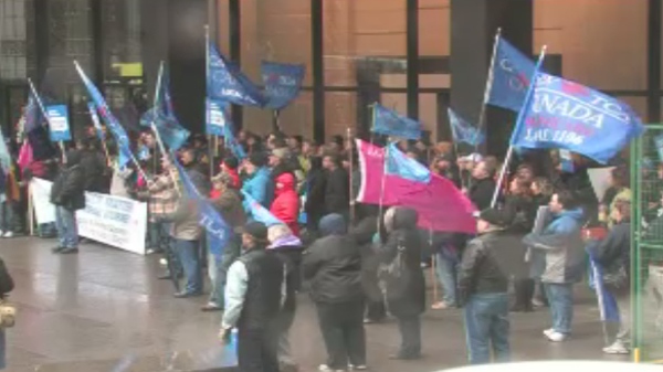 Scores of CAW activists have gathered in downtown Toronto on Monday, April 23, 2012.