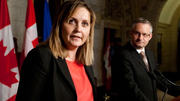 Denmark's Minister for Trade and Investment Pia Olsen Dyhr responds to a question as Canadian International Trade Minister Ed Fast looks on during a joint news conference following meetings in Ottawa, Monday April 23, 2012. (Adrian Wyld / THE CANADIAN PRESS)