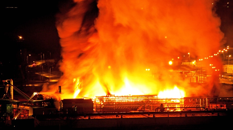 A large fire burns at the Lakeland Mills sawmill in Prince George, B.C., on Tuesday April 24, 2012. (Andrew Johnson / THE CANADIAN PRESS)