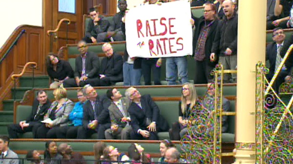 Demonstrators protest from inside Queen's Park, Tuesday, April 24, 2012.