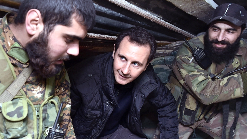Assad vists front line troops in Syria