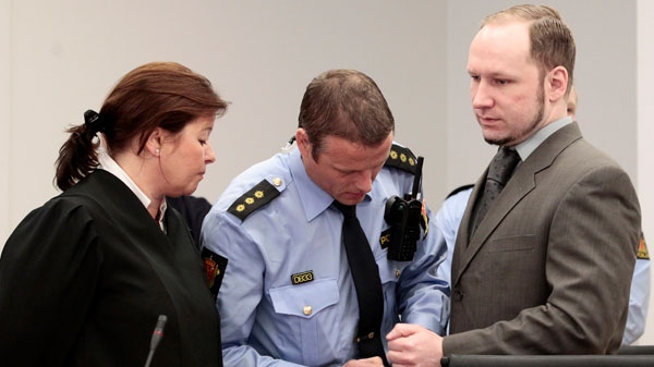 Anders Behring Breivik has his handcuffs removed in the courtroom in Oslo Wednesday morning April 25, 2012. (AP / Hakon Mosvold Larsen)
