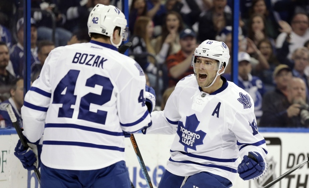 Toronto Maple Leafs right wing Joffrey Lupul (19) celebrates his goal against the Tampa Bay Lightning in Florida, on Monday, Dec. 29, 2014. (AP Photo/Chris O'Meara)