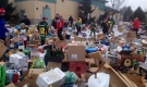 Teams with the Leitrim Minor Hockey Association collect thousands of bottles and cans in support of two local hockey families going through a difficult emotional and financial time. Jan. 3, 2015.