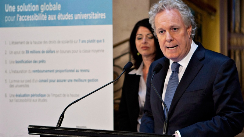 Quebec Premier Jean Charest and Education Minister Line Beauchamp unveil their offers to student over tuition hikes Friday, April 27, 2012. (Jacques Boissinot / THE CANADIAN PRESS)