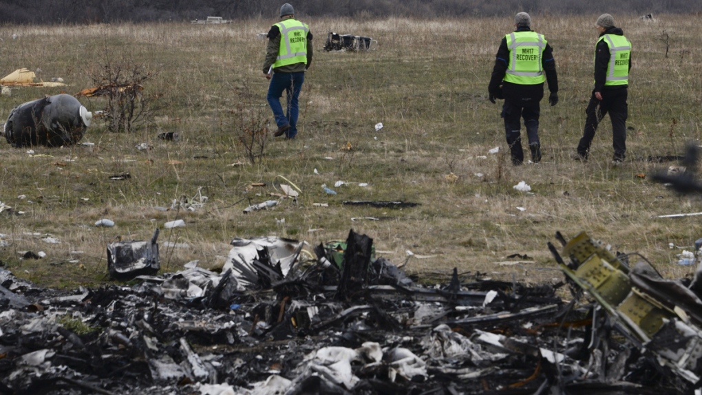 Flight recovery team examines debris from MH17