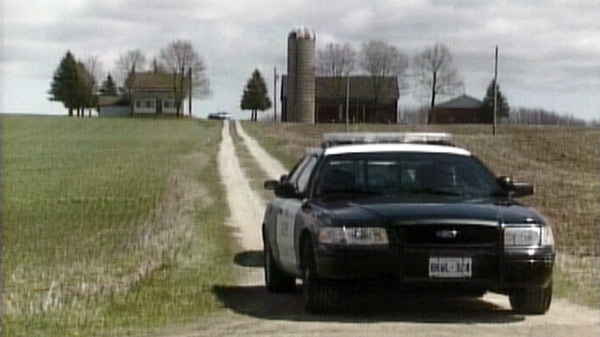 An OPP cruiser sits at the site of a fatal standoff in Chatsworth Township, Ont. on Friday, April 27, 2012.