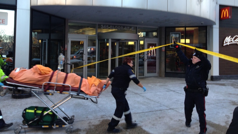 A man is rushed to hospital on a stretcher in Toronto on Wednesday, Jan. 7, 2015. (Ashley Rowe / CTV Toronto)
