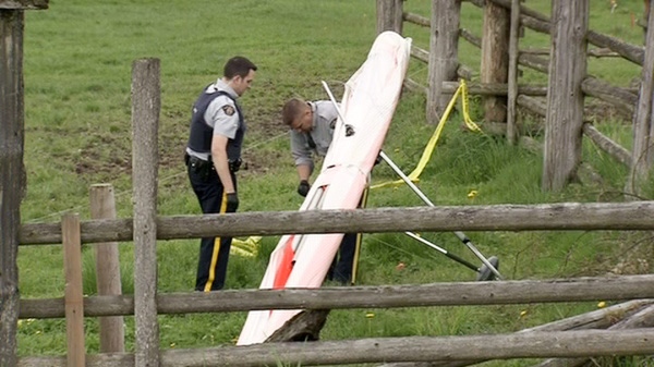 B.C. RCMP collects evidence from a crime scene following the death of a hang glider in Agassiz on Saturday, April 28, 2012.
