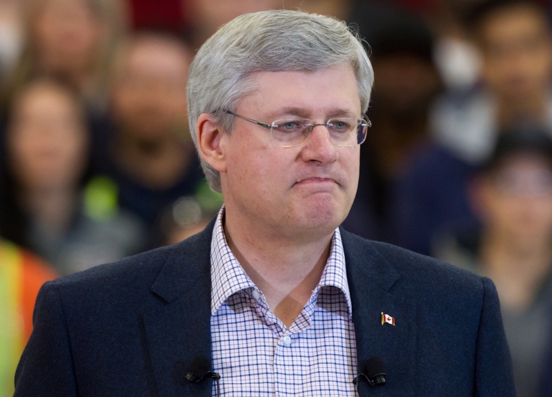 Prime Minister Stephen Harper pauses while speaking about the terrorist attack by masked gunmen in Paris, during an announcement at the British Columbia Institute of Technology Annacis Island Campus in Delta, B.C., on Thursday, Jan. 8, 2015. (Darryl Dyck / THE CANADIAN PRESS)