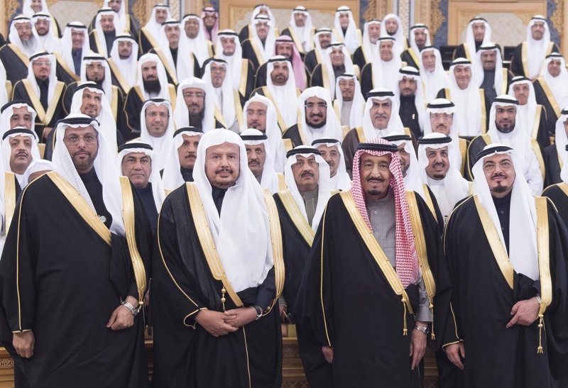 In this image released by Saudi Press Agency, Saudi Arabia's Crown Prince Salman bin Abdulaziz Al Saud, 2nd right first row, poses with Shura members at consultative Shura Council in Riyadh, Saudi Arabia, Tuesday, Jan. 6, 2015. (AP Photo/Saudi Press Agency)