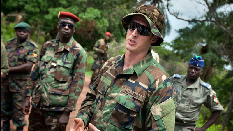 U.S. Army special forces Capt. Gregory  speaks with troops from the Central African Republic and Uganda, in Obo, Central African Republic, Sunday, April 29, 2012, where they are searching for infamous warlord Joseph Kony. (AP / Ben Curtis)