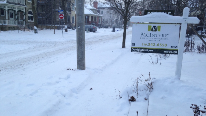 Snow blocks off a 'For Sale' sign on Young Street in Kitchener on Friday, Jan. 9, 2015. (Abigail Bimman / CTV Kitchener)