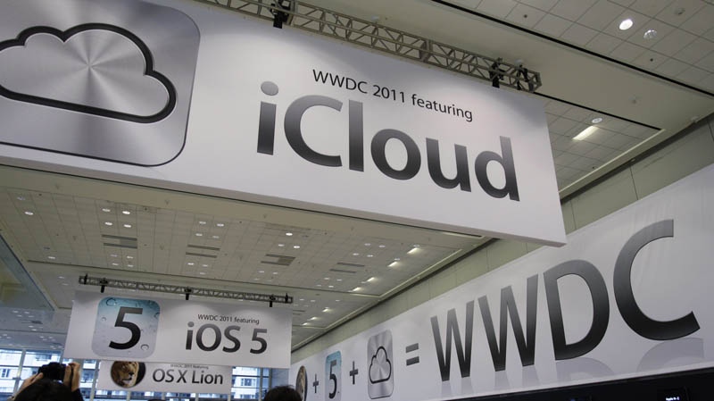 In this June 6, 2011 file photo, posters are displayed at the Apple Worldwide Developers Conference in San Francisco. 