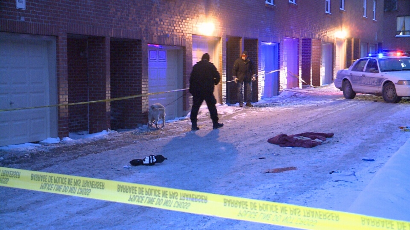 Ottawa Police investigate the first shooting of the year in the 100 block of Riga Private on Saturday, Jan. 10, 2015.
