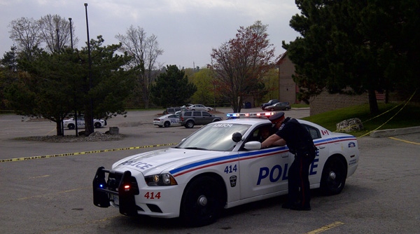 Police investigate an incident at a Travelodge motel in Barrie, Ont. on Wednesday, May 2, 2012.