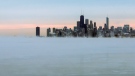 Steam rises over Lake Michigan near the Chicago skyline, Thursday, Jan. 8, 2015. (AP Photo/Teresa Crawford)