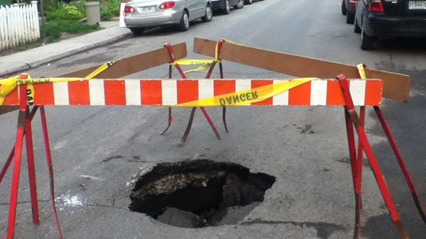 This sinkhole opened up Wednesday afternoon on Old Orchard Ave. in NDG (May 3, 2012)