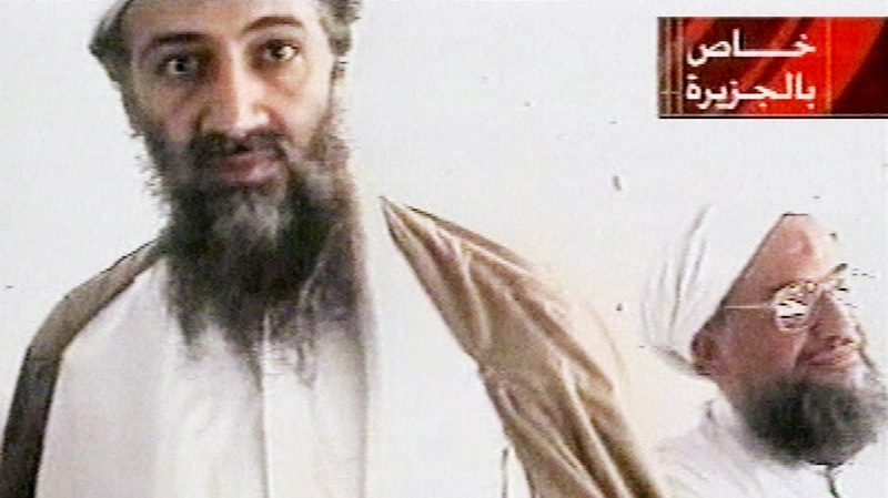 This undated image taken from video released by Qatar's Al-Jazeera televison broadcast Oct. 5, 2001, purports to show al-Qaida leader Osama bin Laden, left, and his top lieutenant, Egyptian Ayman al-Zawahiri. (AP / Courtesy of Al-Jazeera via APTN)