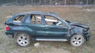 Severely damaged 2002 BMW X5 following Trans-Canada Highway crash near Lake Louise on May 24, 2014 (RCMP) 