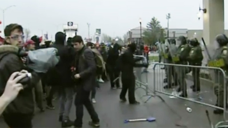 The demonstrators advanced past the barriers Friday in Victoriaville, only to come face to face with SQ riot police. 