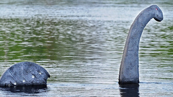 A sculpture resembling the Loch Ness monster rises out of the Chippewa River in Eau Claire, Wisconsin, on Monday, April 30, 2012. (AP / Eau Claire Leader-Telegram, Dan Reiland)