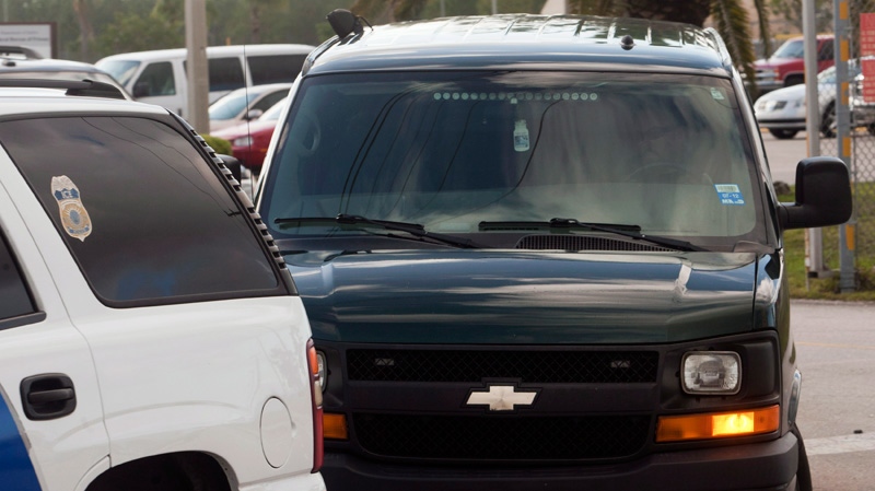 A U.S immigration van carrying former media baron Conrad Black leaves the Federal Correction Institute in Miami on Friday, May 4, 2012. (Ryan Remiorz / THE CANADIAN PRESS)