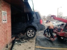 An SUV crashed into a Spartan Nutrition & Fitness Centres Inc. store on Talbot Street West in Leamington, Jan.16, 2015. (Sacha Long / CTV Windsor)
