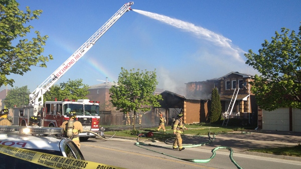 Fire fighters battle a blaze at a home in Richmond Hill, Sunday, May 6, 2012. (Tom Podolec / CTV News)
