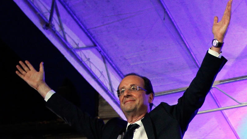 President-elect Francois Hollande waves to the crowd after his election in Tulle, central France