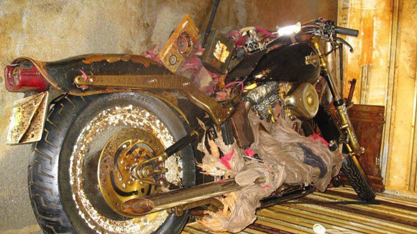 A rust-encrusted Harley-Davidson motorcycle, shown in this undated handout photo, made buoyant by the sea container in which it was stored, washed up on an island off the coast of British Columbia after it was lost in last year's tsunami in Japan, about 6,400 kilometres away. (Peter Mark / THE CANADIAN PRESS)